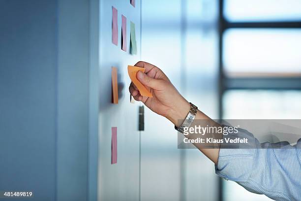 hand writing on colorful post-it notes on wall - (position) stock pictures, royalty-free photos & images