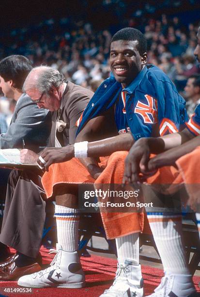 Bernard King of the New York Knicks looks on from the bench against the Washington Bullets during an NBA basketball game circa 1985 at the Capital...