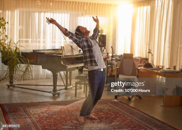 man dancing with headphones on - man freedom stock pictures, royalty-free photos & images