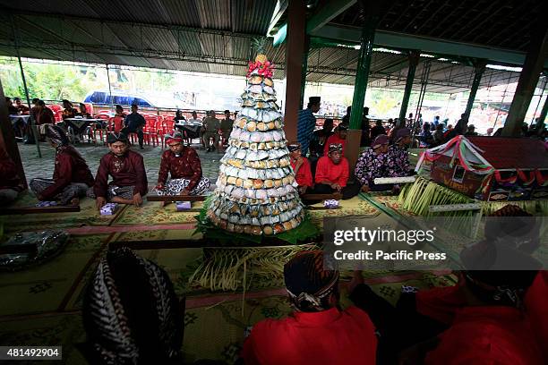 Residents dressed up in traditional Javanese clothes to follow the Nyadran ritual at the Sewu Cemetery. The Nyadran ritual is a tradition where the...