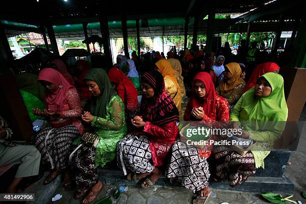 Residents dressed up in traditional Javanese clothes to follow the Nyadran ritual at the Sewu Cemetery. The Nyadran ritual is a tradition where the...