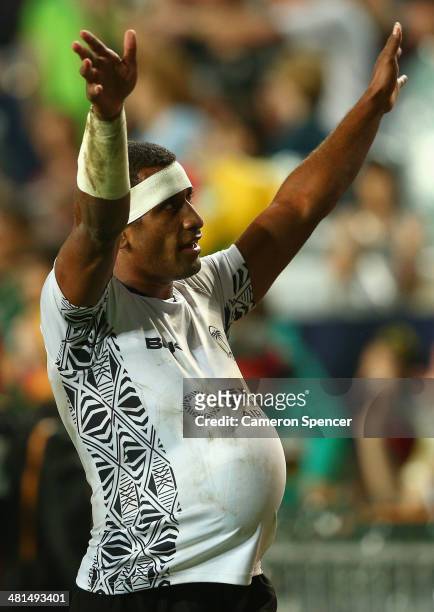 Emosi Mulevoro of Fiji thanks the crowd after winning the Cup play off match during the 2014 Hong Kong Sevens at Hong Kong International Stadium on...