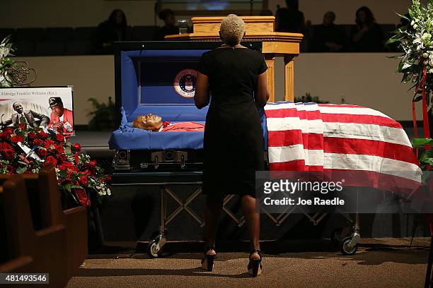 Family and friends pay their respects to retired Air Force Lt. Col. Eldridge Williams during his funeral at the Sweet Home Missionary Baptist Church...