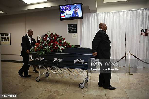 Pall bearers from Paradise Memorial Funeral Home take the casket of retired Air Force Lt. Col. Eldridge Williams to the hearse after a funeral...