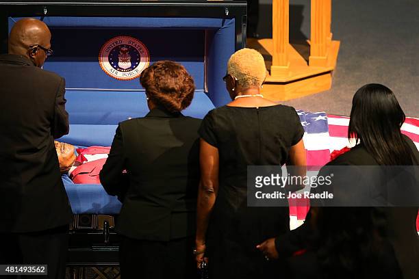 Family and friends pay their respects to retired Air Force Lt. Col. Eldridge Williams during his funeral at the Sweet Home Missionary Baptist Church...