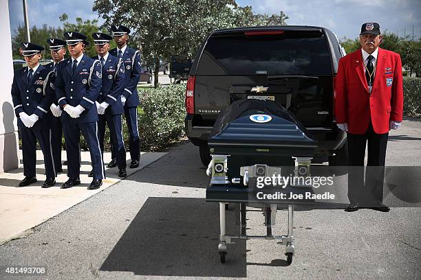 Members of the U.S. Air Force 482nd Fighter Wing Honor Guard and Herbert Otey, from Tuskegee Airmen, inc, prepare to bring the casket of retired Air...