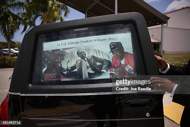 Poster board with photographs of retired Air Force Lt. Col. Eldridge Williams is placed in the window of the hearse during his funeral at the Sweet...