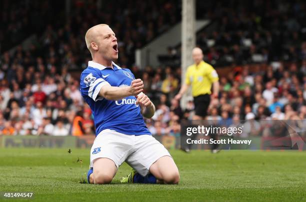 Steven Naismith of Everton celebrates the opening goal, an own goal by David Stockdale of Fulham during the Barclays Premier League match between...