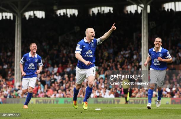 Steven Naismith of Everton celebrates the opening goal, an own goal by David Stockdale of Fulham during the Barclays Premier League match between...