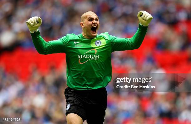 Bobby Olejnik of Peterborough celebrates after his team mate Josh Mcquoid scored the opening goal of the game during the Johnstone's Paint Trophy...