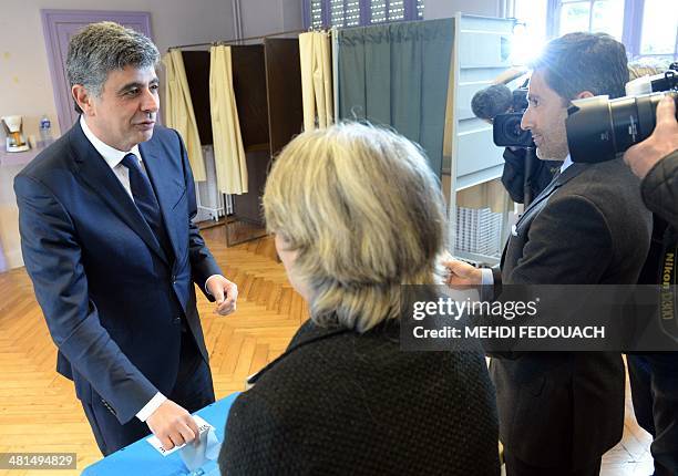 French Socialist Party mayoral candidate in Pau, David Habib casts his ballot during the second round of the French municipal elections on March 30,...