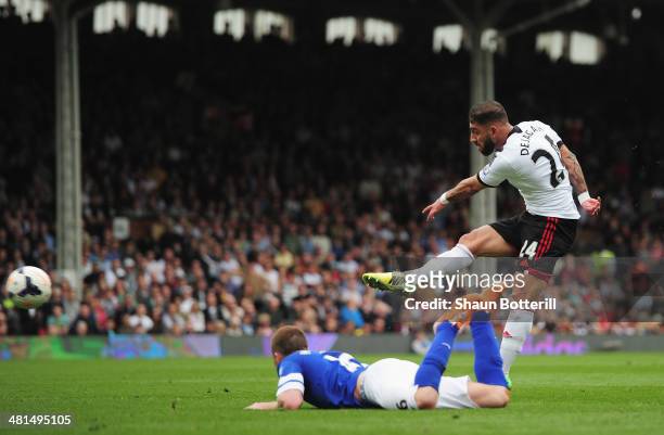 Ashkan Dejagah of Fulham scores his team's first goal during the Barclays Premier League match between Fulham and Everton at Craven Cottage on March...