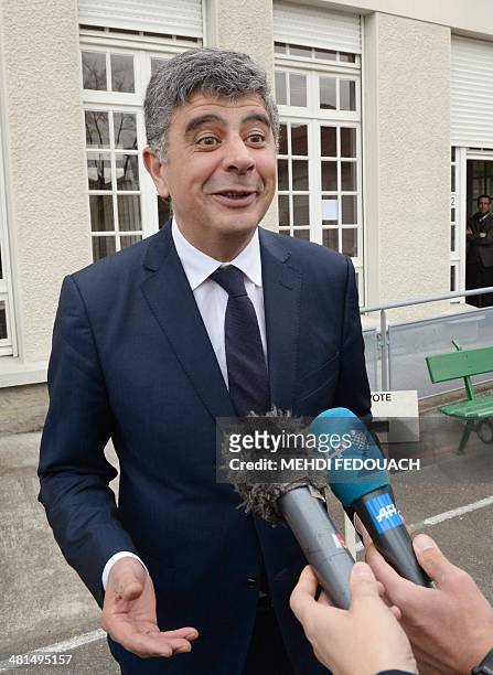 French socialist party candidate at the municipal elections in Pau, David Habib, speaks to journalists after casting his ballot in the second round...