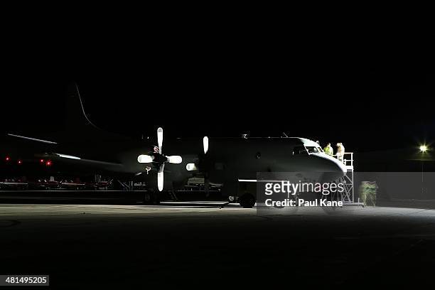 Ground crew work on a RAAF P3 Orion at RAAF base Pearce on March 30, 2014 in Perth, Australia. The Australian Defence vessel, Ocean Shield, departed...