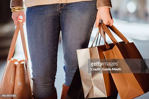 woman carrying shopping bags. - grocery bag stock pictures, royalty-free photos & images