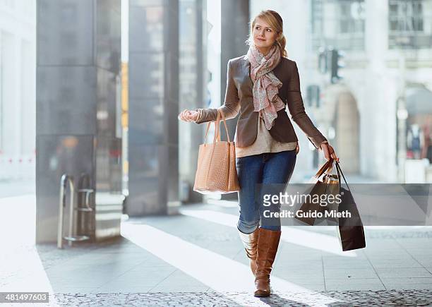 woman carrying shopping bags. - tote bag white stock pictures, royalty-free photos & images