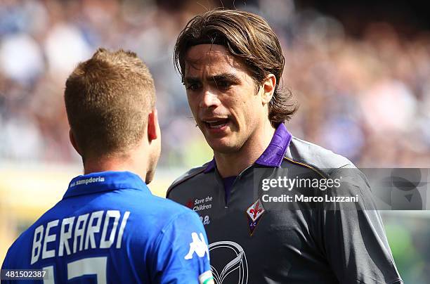 Alessandro Matri of ACF Fiorentina disputes with Gaetano Berardi of UC Sampdoria during the Serie A match between UC Sampdoria and ACF Fiorentina at...