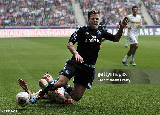 Dennis Diekmeier of Hamburger SV is tackled by Filip Daems of Moenchengladbach during the Bundesliga match between Borussia Moenchengladbach and...