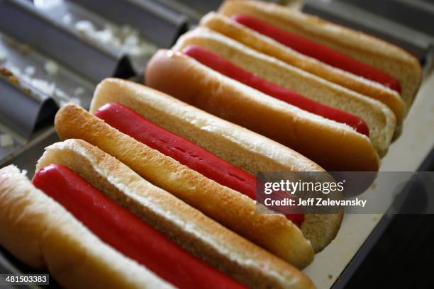 Martinsville Slider hot dogs are prepared in a concession stand prior to the start of the NASCAR Sprint Cup Series STP 500 at Martinsville Speedway...