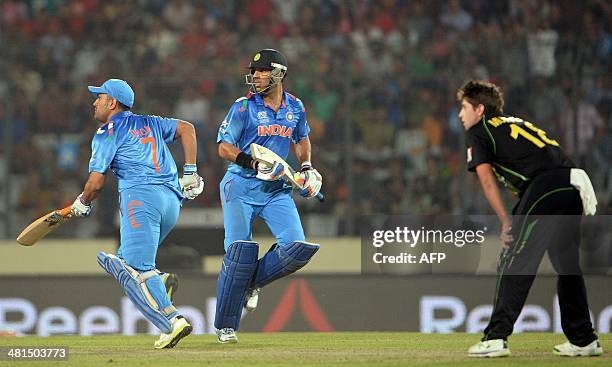 India batsmen Yuvraj Singh and Mahendra Singh Dhoni run between the wickets during the ICC World Twenty20 tournament cricket match between India and...