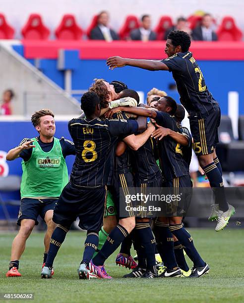 Fernando Aristeguieta of Philadelphia Union is swarmed by teammates after he scored the game winning penalty shot against the New York Red Bulls...