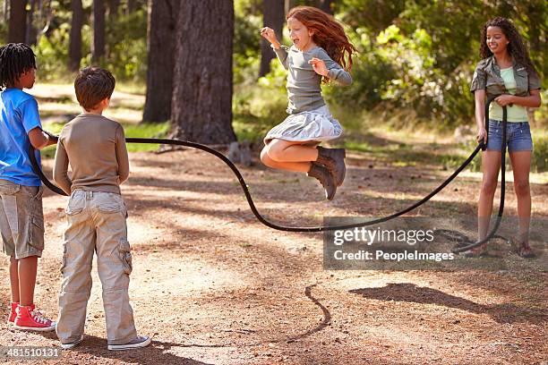 summer camp is full of fun and friendship - jumping rope stock pictures, royalty-free photos & images