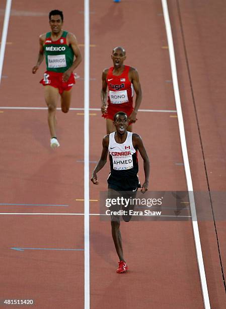 Mohammed Ahmed of Canada beats Aron Rono of the United States and Juan Luis Barrios of Mexico across the finish line to win the men's 10000 meter...