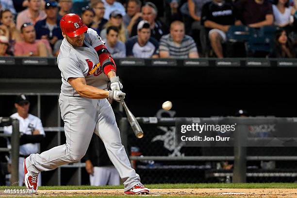 Matt Holliday of the St. Louis Cardinals hits a grand slam against the Chicago White Sox during the fourth inning at U.S. Cellular Field on July 21,...