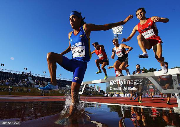 Gerad Giraldo of Columbia leaps over the water jump during the Men's 3000m Steeplechase at the Pan Am Games on July 21, 2015 in Toronto, Canada.