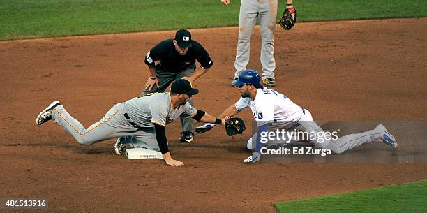 Eric Hosmer of the Kansas City Royals is tagged out by Brent Morel of the Pittsburgh Pirates as he tries to stretch a single in the fourth inning...