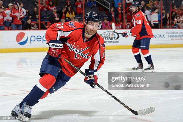 Karl Alzner of the Washington Capitals warms up before playing the Boston Bruins during an NHL game at Verizon Center on March 29, 2014 in...