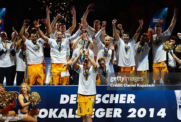 Sven Schultze of Berlin celebrates with team mates after the Beko BBL Top Four final match between Alba Berlin and ratiopharm Ulm at ratiopharm arena...