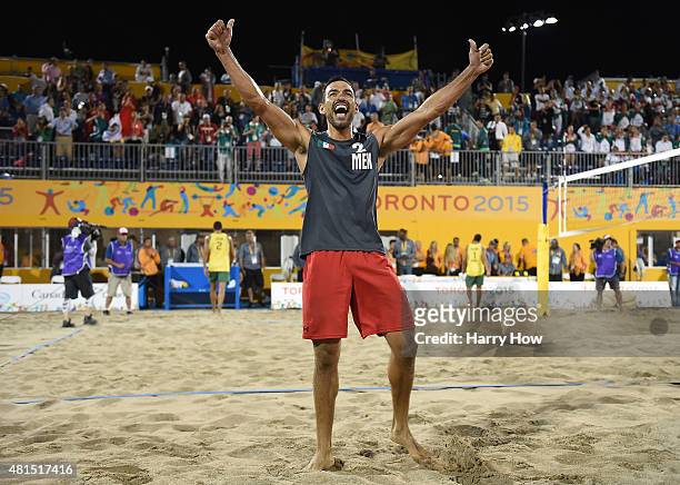 Juan Virgen of Mexico celebrates a gold medal over Brazil in the men's beach volleyball gold medal final during the 2015 Pan Am Games at the...