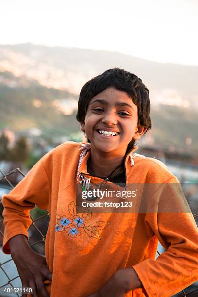 indian girl on rooftop of building overlooking shillong, india. - 11 year old indian girl stock pictures, royalty-free photos & images