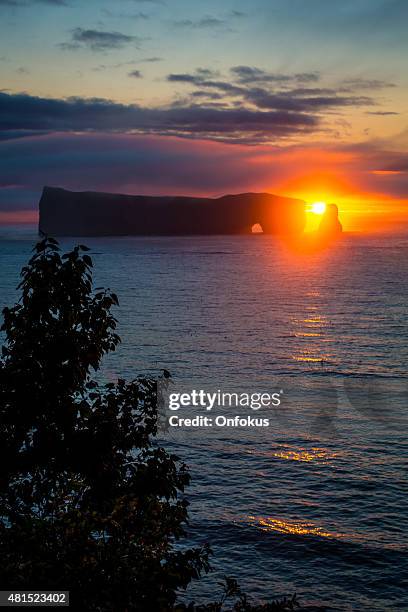 perce rock on the gaspe peninsula at sunrise - gaspe peninsula stock pictures, royalty-free photos & images