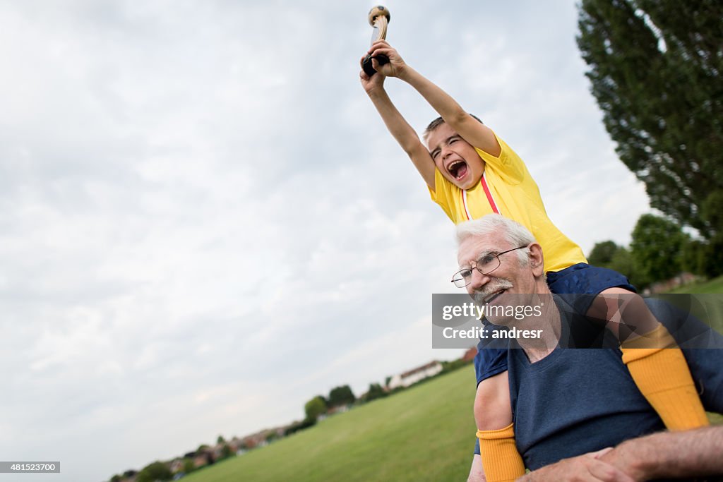 Boy winning a soccer tournament at school