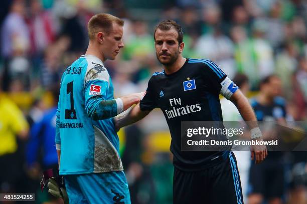 Rafael van der Vaart of Hamburger SV shakes hands with goalkeeper Marc-Andre ter Stegen of Moenchengladbach after the Bundesliga match between...