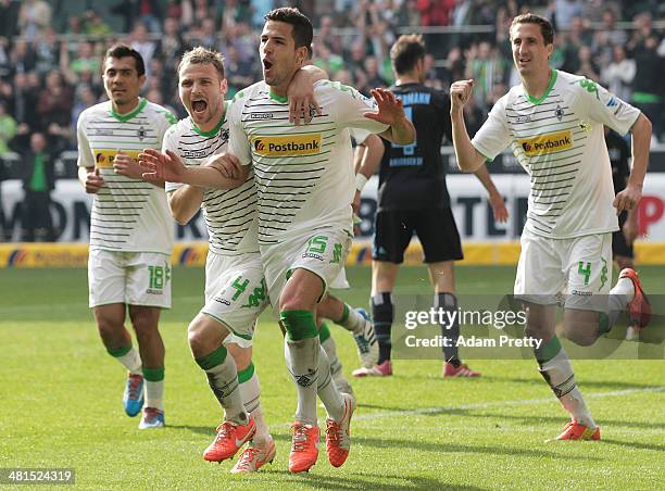 Alvaro Dominguez of Moenchengladbach celebrates after scoring a goal during the Bundesliga match between Borussia Moenchengladbach and Hamburger SV...