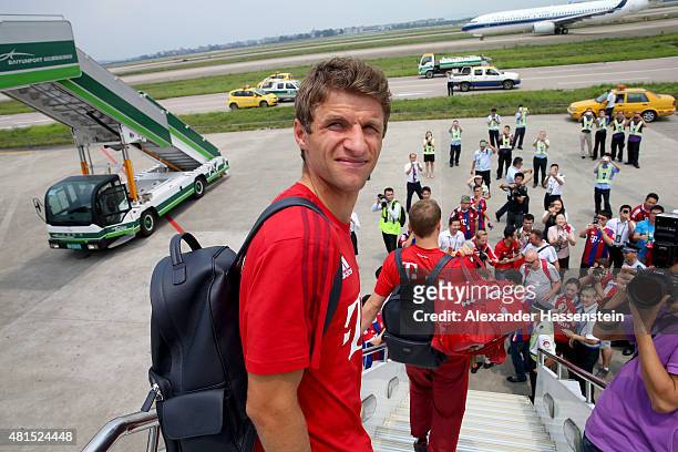 Thomas Mueller of FC Bayern Muenchen arrives with the team at Guangzhou International Airport on day 6 of the FC Bayern Audi China Summer Pre-Season...