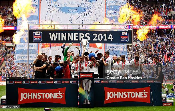 Peterborough players celebrate with the trophy after winning the Johnstone's Paint Trophy Final between Chesterfield and Peterborough United at...