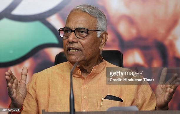 Senior BJP leader and former finance minister Yashwant Sinha addresses a press conference on the economic issue at BJP HQ Office on March 30, 2014 in...