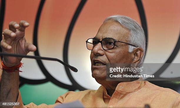 Senior BJP leader and former finance minister Yashwant Sinha addresses a press conference on the economic issue at BJP HQ Office on March 30, 2014 in...