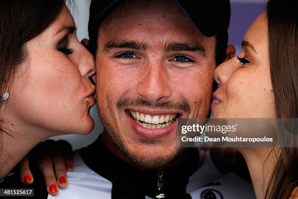 John Degenkolb of Germany smiles as he gets a kiss on each cheek after winning the Gent-Wevelgem Cycle Race on March 30, 2014 in Gent, Belgium.