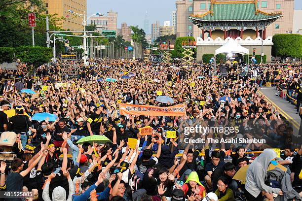 Protestors holds signs as over two hundred thousand people rally on March 30, 2014 in Taipei, Taiwan. Taiwanese student protesters opposing the...