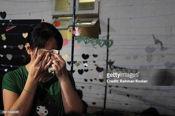 Volunteer prepares for an event to remember the victim of the ill-fated flight MH370 on March 30, 2014 in Kuala Lumpur, Malaysia. The Australian...
