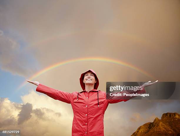 she's found her rainbow moment! - winter woman showing stock pictures, royalty-free photos & images