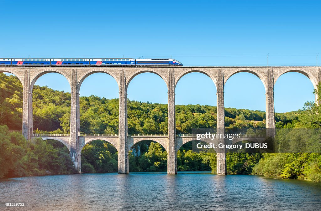 French TGV train on stone viaduct in Rhone-Alpes France