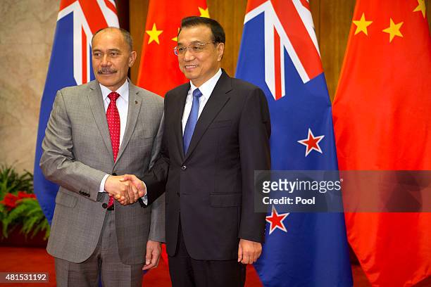 New Zealand's Governor-General Sir Jerry Mateparae, left, shakes hands with Chinese Premier Li Keqiang, right, as he arrives for a bilateral meeting...
