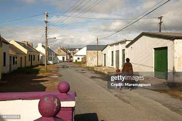 tory island, walking in an alley of the town - county donegal stockfoto's en -beelden