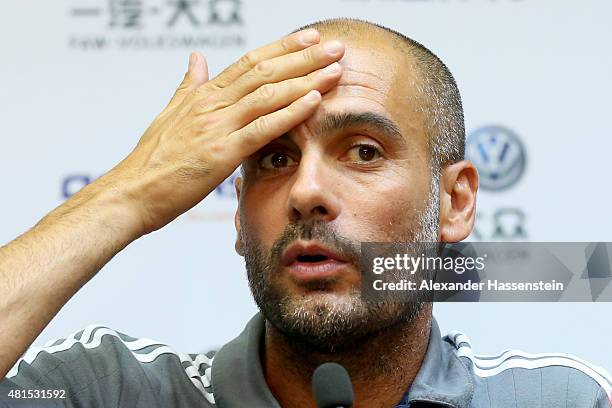 Josep Guardiola, head coach of FC Bayern Muenchen talks to the media during a press conference at Tianhe Stadium on day 6 of the FC Bayern Audi China...